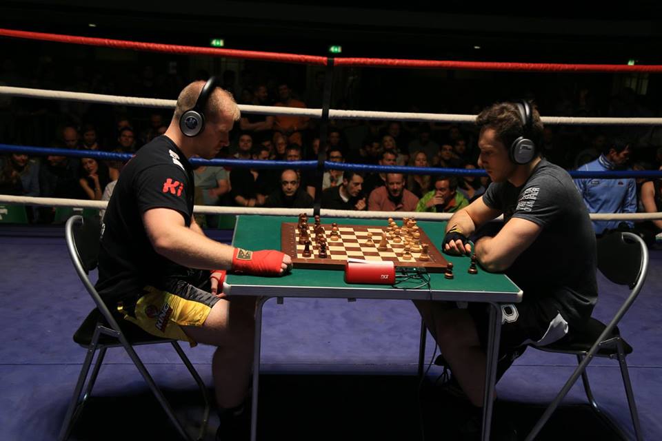 Chessboxing, boxing and chess board game being played alternately